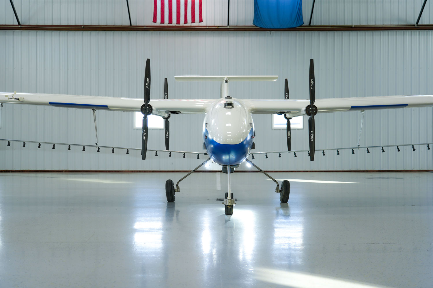 Pyka Pelican 2 autonomous crop-protection aircraft in a hangar. Vendor product image.